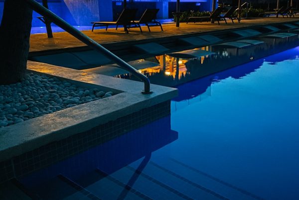 swimming pool near trees during night time