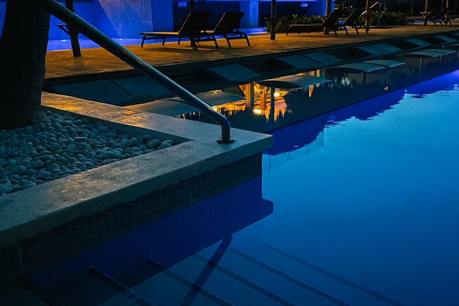 swimming pool near trees during night time